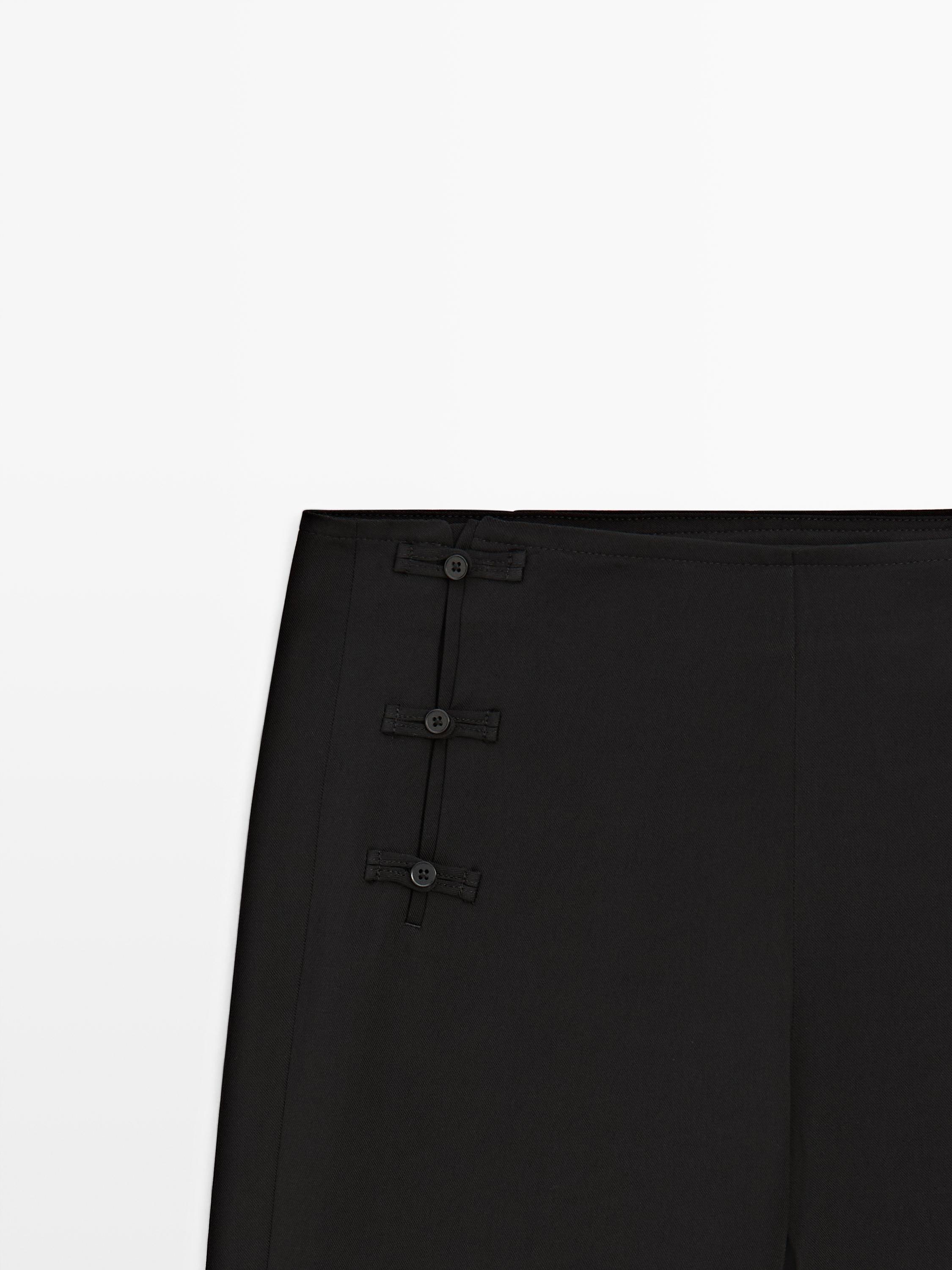 Pantalon capri avec boutons